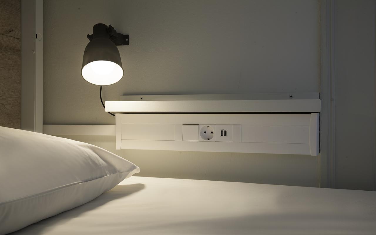 Cama en habitación compartida femenina de 6 camas